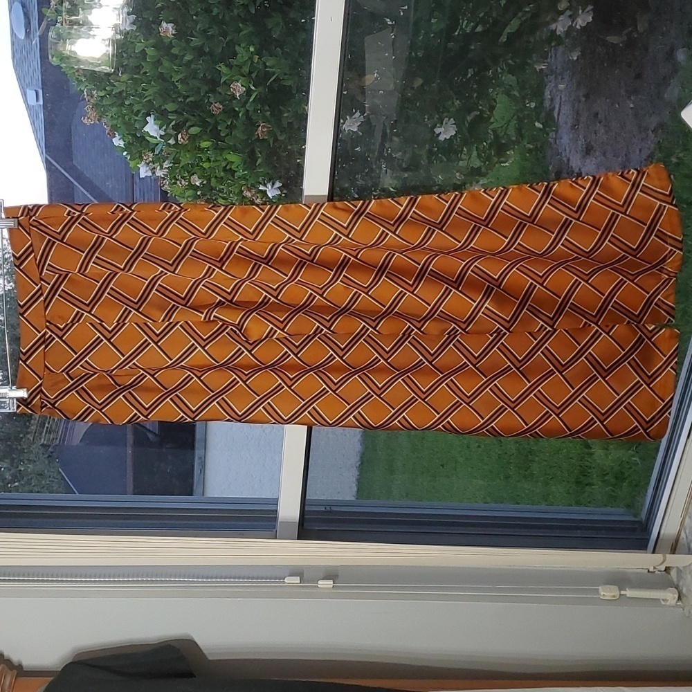 FOREVER 21, wide leg pants size‎ medium. Gold/rust color. With geometric design.
